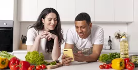 Happy older couple cuddling on couch